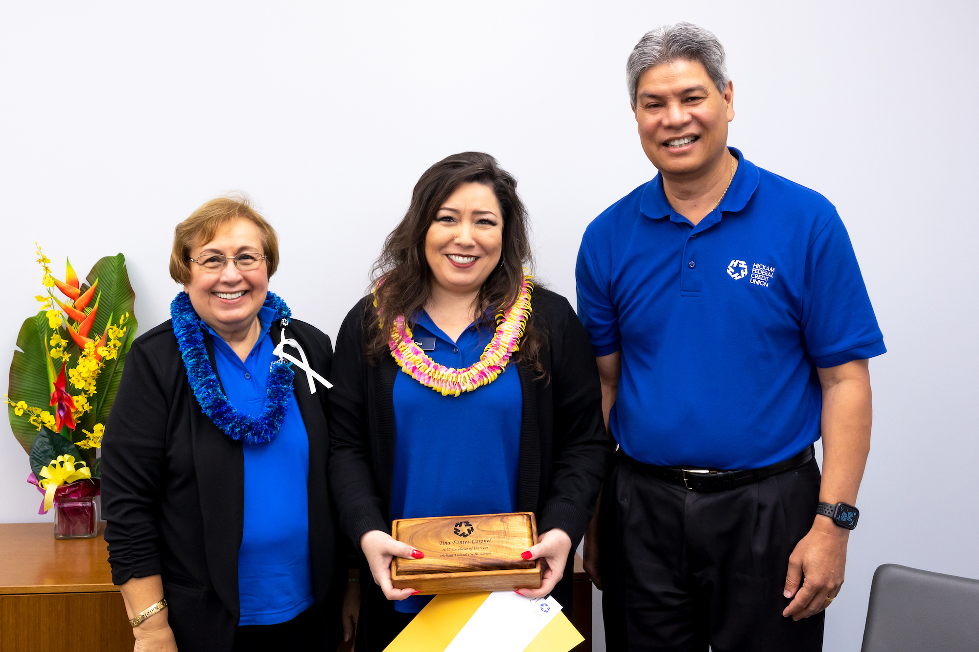 2022 Employee of the Year Tina poses with Hickam FCU Board Chair Carol Ebia and President/CEO Scott Kaulukukui
