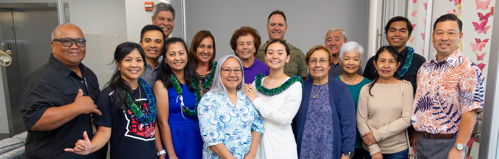 Group photo of scholarship recipients, parents, staff, and volunteers.